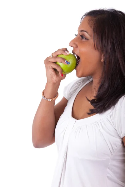 Young indian woman eating an apple Stock Image