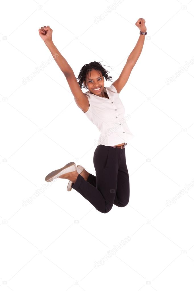 Young african american business woman jumping, success concept