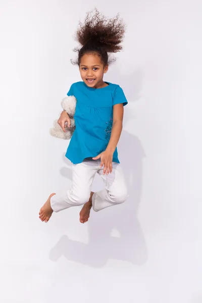 Portrait of Young African American girl jumping — Stock Photo, Image