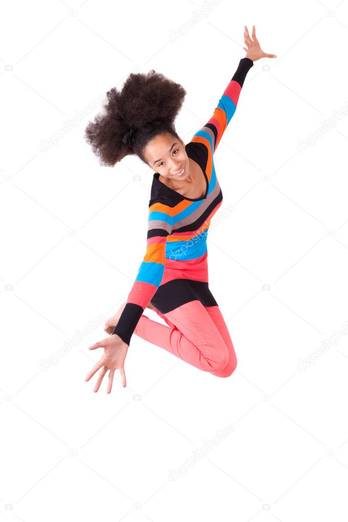 Black African American teenage girl with a afro haircut jumping