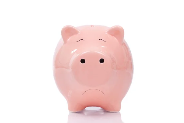 Sad piggy bank isolated on white background — Stock Photo, Image