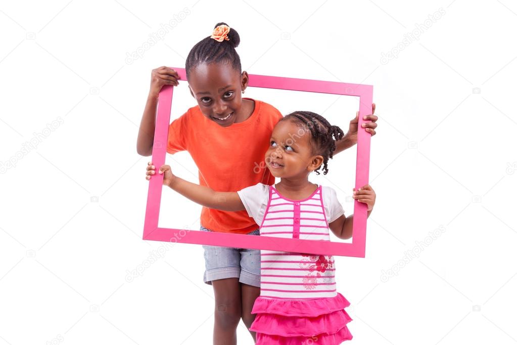 Little african american girls holding a picture frame