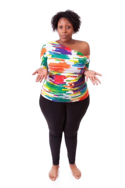 Hesitating young fatty black woman looking up - African — Stock Photo, Image