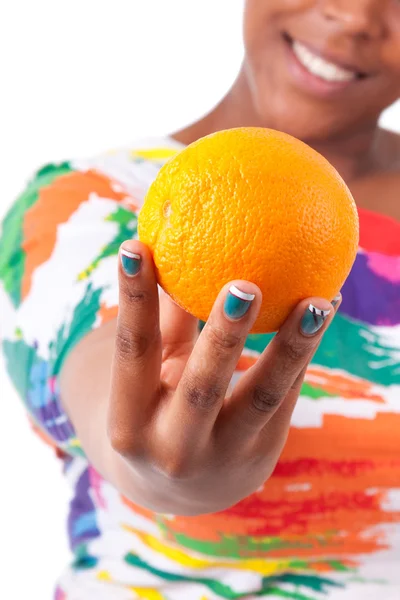 Overweight young black woman holding an orange - African — Stock Photo, Image
