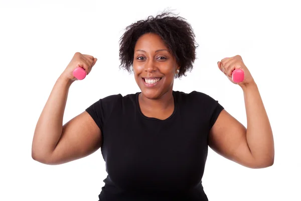 Portré egy fekete zsíros nő dolgozik ki a szabad súlyok - — Stock Fotó
