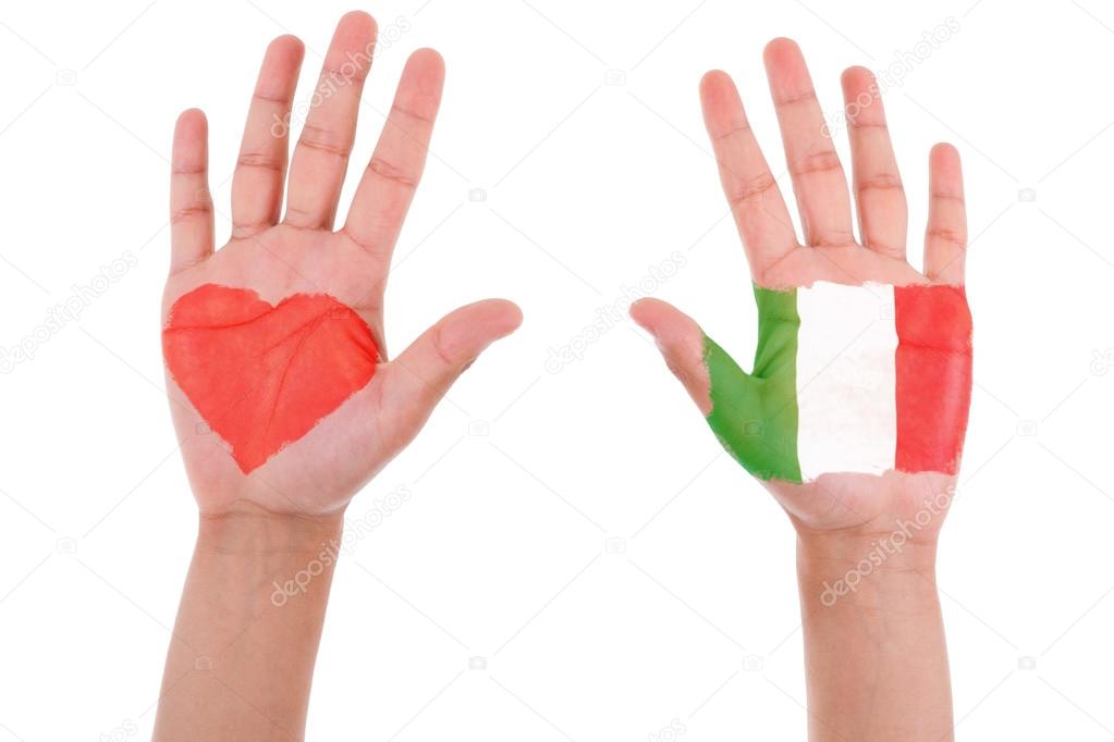 Hands with a painted heart and italian flag, i love italy concep
