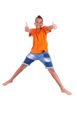 Portrait of a cute teenage black boy jumping over white backgrou clipart