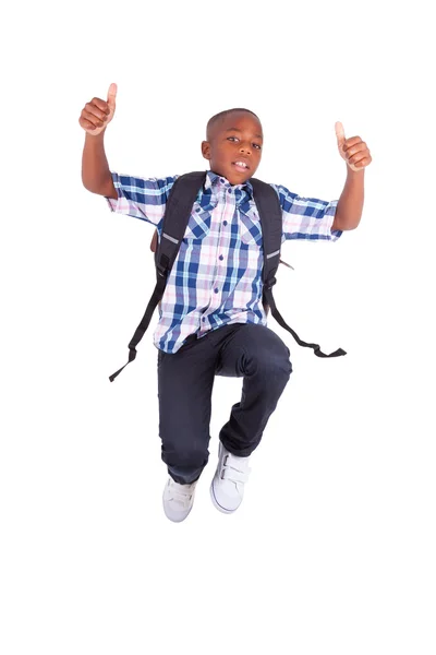 Menino da escola afro-americana pulando e fazendo polegares para cima - Preto — Fotografia de Stock