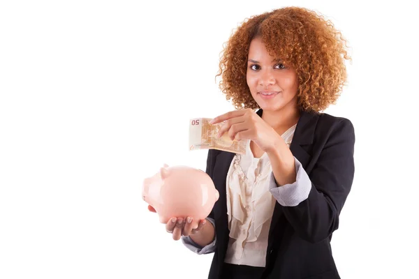 Jovem mulher de negócios afro-americana segurando um banco porquinho - Afr — Fotografia de Stock