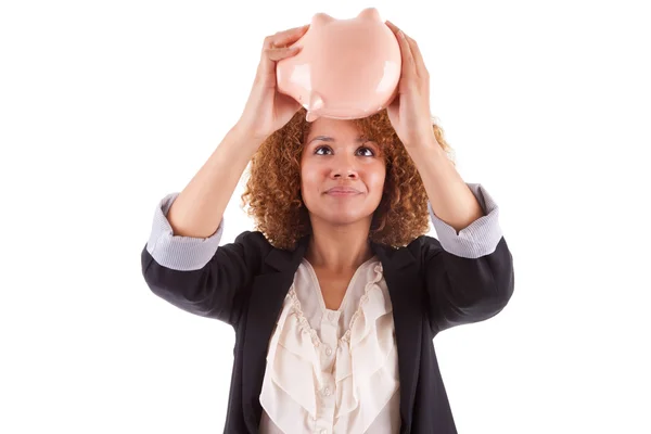 Jovem mulher de negócios afro-americana segurando um banco porquinho - Afr — Fotografia de Stock