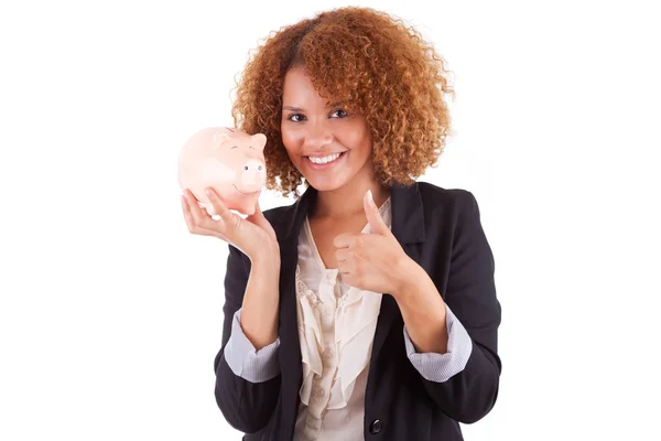 Young african american business woman holding a piggy bank - Afr — Stock Photo, Image