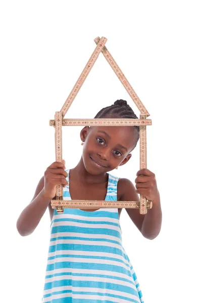 Little african girl holding a house shape - Black people — Stock Photo, Image