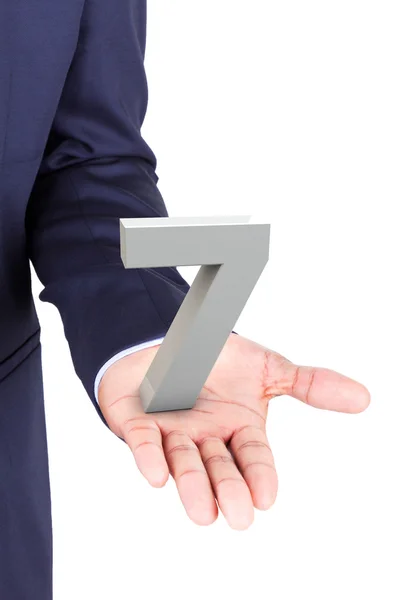 Business man holding a 3d number in hand palm — Stock Photo, Image