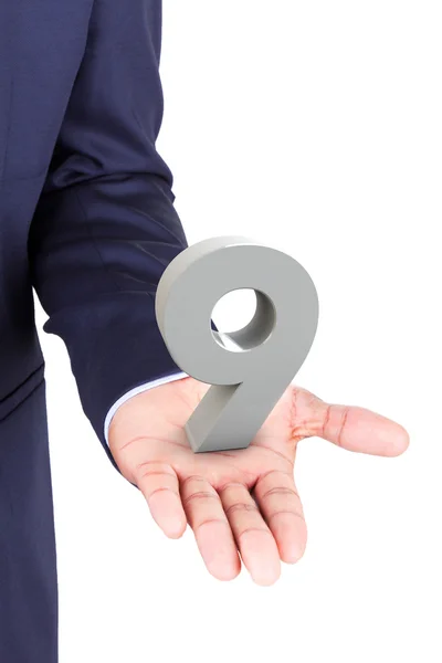 Business man holding a 3d number in hand palm — Stock Photo, Image