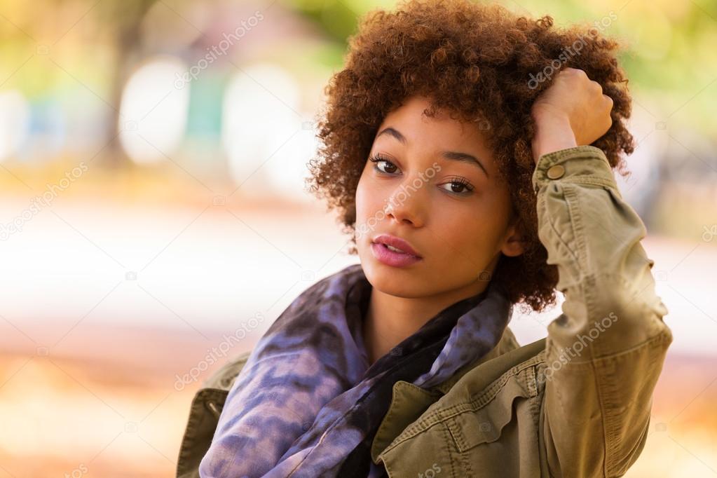 Autumn outdoor portrait of beautiful African American young woma