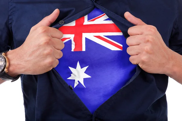 Young sport fan opening his shirt and showing the flag his count — Stock Photo, Image