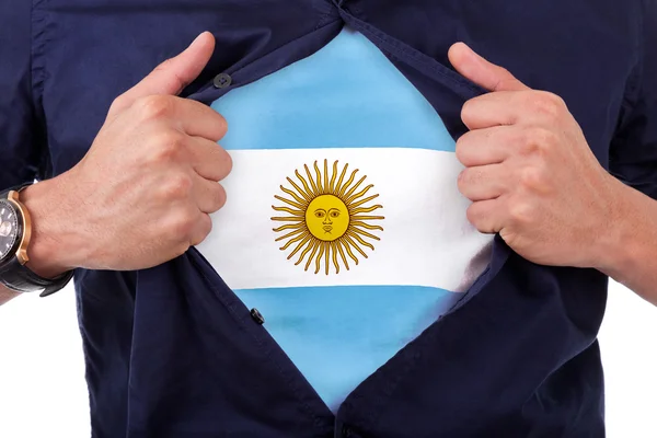 Young sport fan opening his shirt and showing the flag his count — Stock Photo, Image