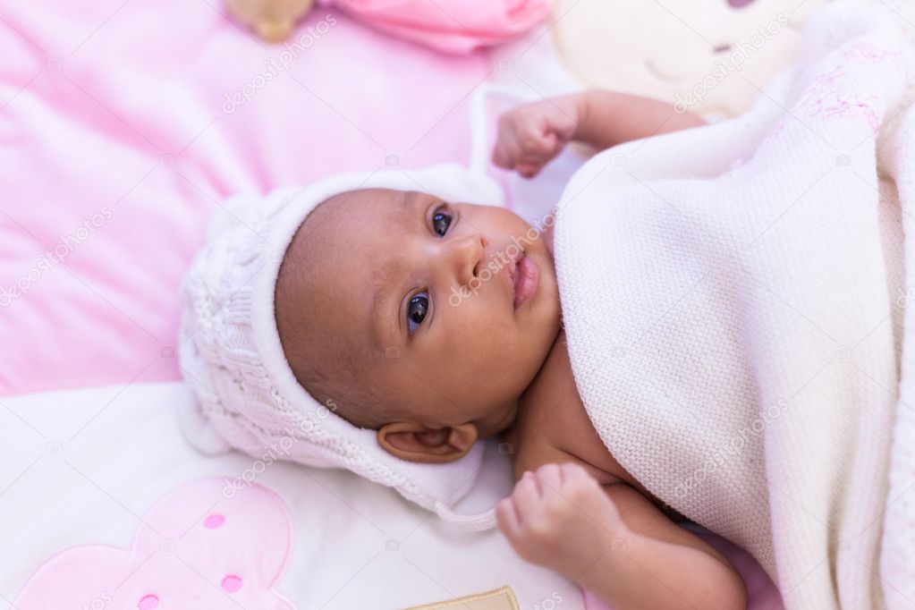 Adorable little african american baby girl looking - Black peopl