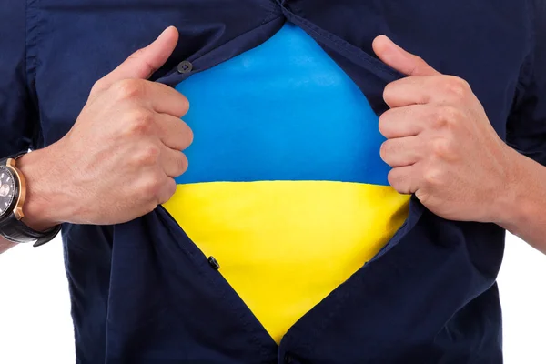 Ung sport fan öppna sin skjorta och visar flaggan för hans räkning — Stockfoto