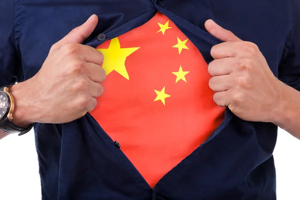 Young sport fan opening his shirt and showing the flag his count — Stock Photo, Image