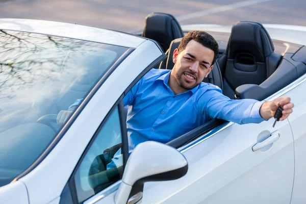 Young black latin american driver holding car keys driving his n — Stock Photo, Image