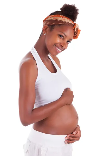 Young pregnant black woman touching her belly - African people Stock Image