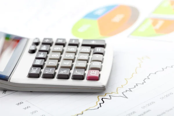 Financial data analyzing. Counting on calculator. — Stock Photo, Image