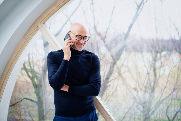 Shot Confident Man Wearing Casual Clothes While Standing Window Talking Stock Picture