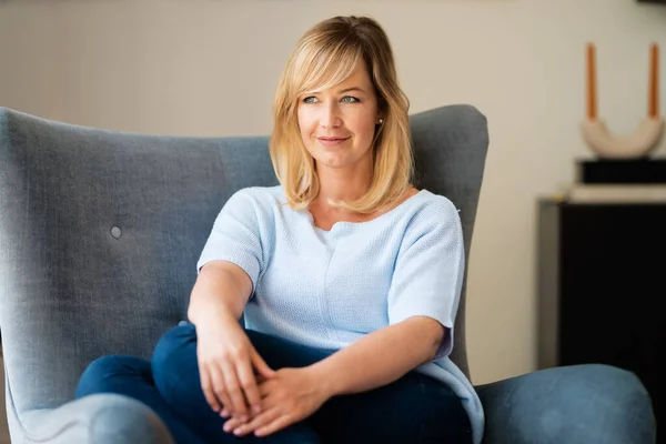 Portrait Blond Haired Middle Aged Woman Relaxing Armchair Home — Stockfoto