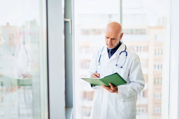 Portrait Male Doctor Standing Corridor Holding Diary His Hand — Stockfoto