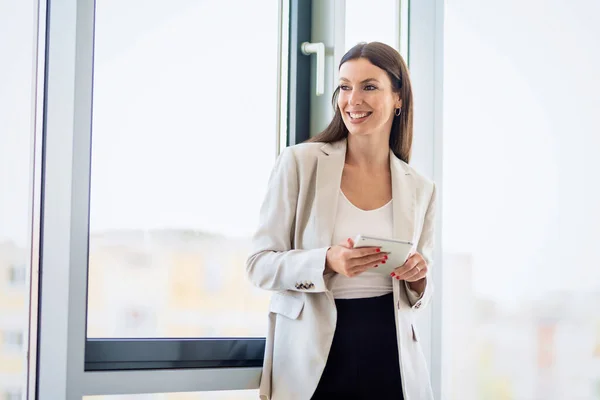 Portrait Attractive Businesswoman Using Digital Tablet While Standing Window Modern — Fotografia de Stock