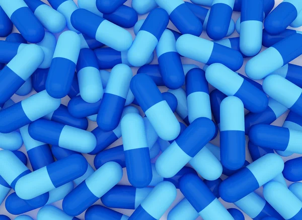 Achtergrond van de blauwe pillen — Stockfoto