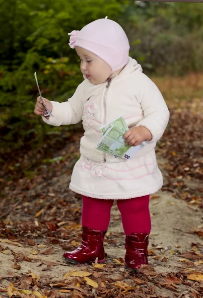 Baby with money — Stock Photo, Image