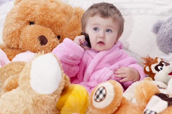 Little girl with toys — Stock Photo, Image