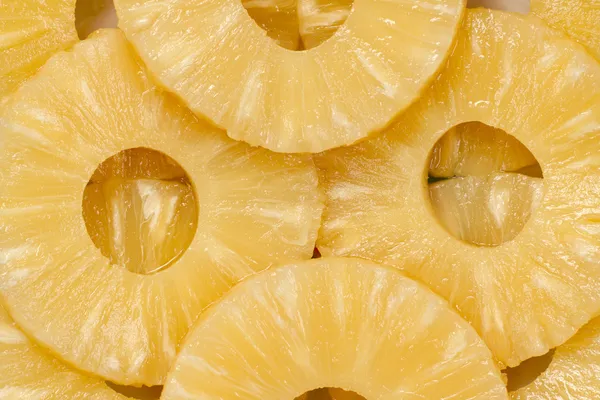 Pineapple slices as background — Stock Photo, Image