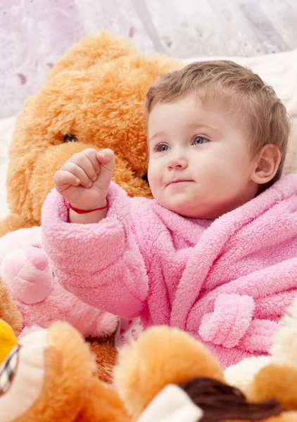 Little girl with toys — Stock Photo, Image