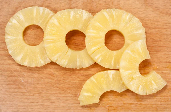 Pineapple slices on the board — Stock Photo, Image