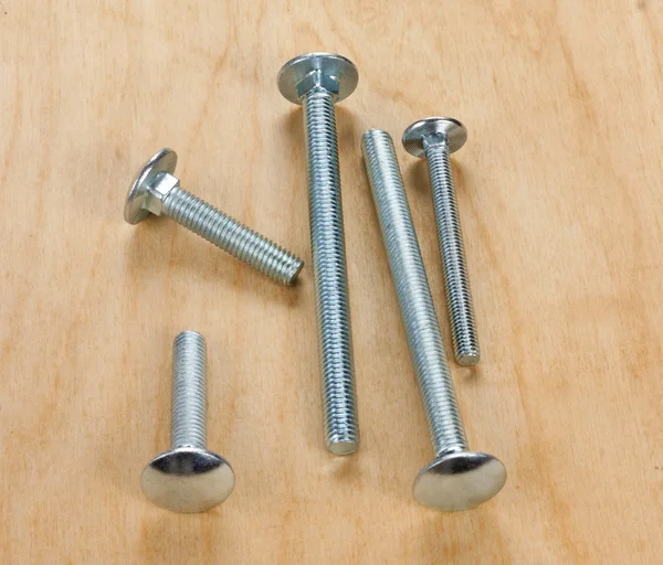 Screws on a wooden board — Stock Photo, Image