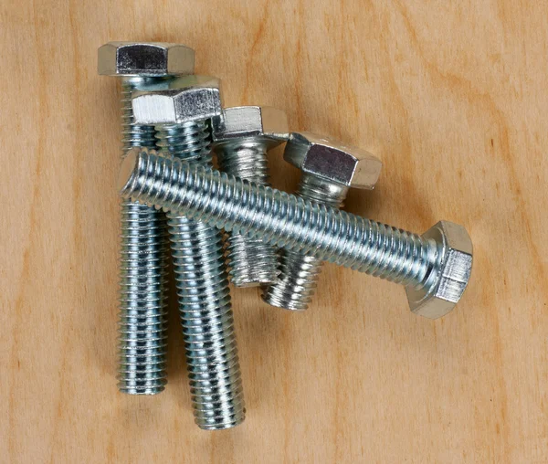 Screws on a wooden board — Stock Photo, Image