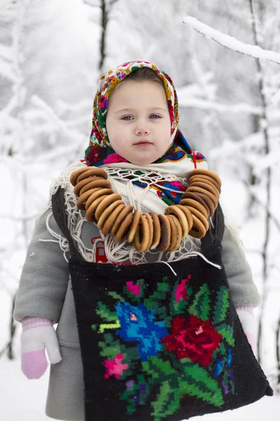 Little girl with bagels — Stock Photo, Image