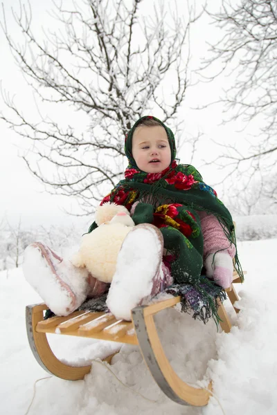 Girl on a sled — Stock Photo, Image