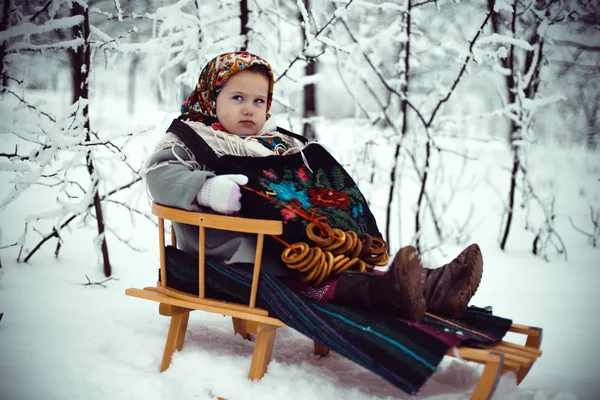 Girl on a sled — Stock Photo, Image