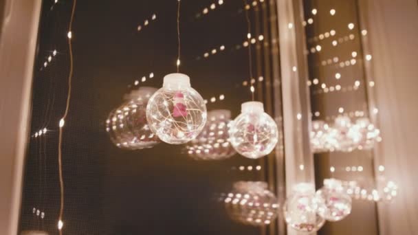 Window decorated with a garland with balls — Stock Footage Window decorated with a garland with balls Royalty Free Stock Footage