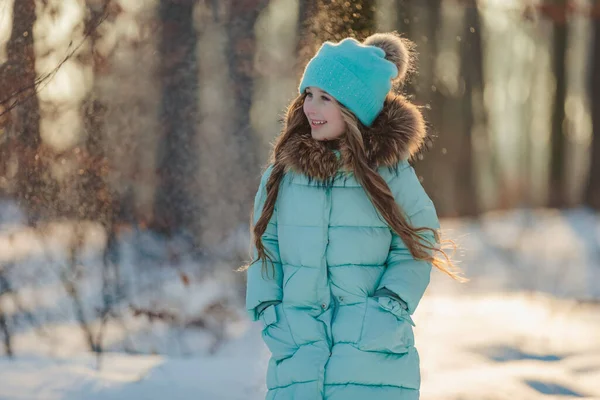 Girl in a turquoise jacket and hat — Foto Stock