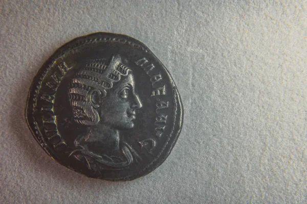 Old roman coin on white paper — Stock Photo, Image