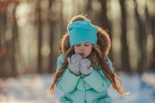 Little Girl Blows Snow Her Mittens — Stock Photo, Image