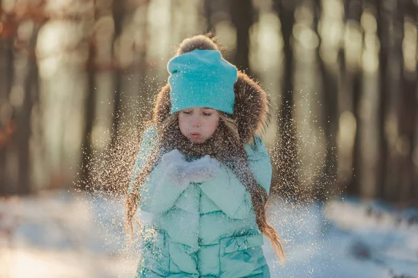 Little Girl Blows Snow Her Mittens — Stock Photo, Image