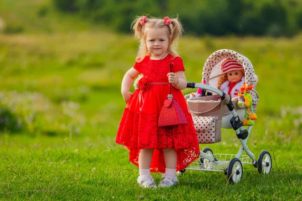 Girl Playing Doll Stroller Nature — Stockfoto