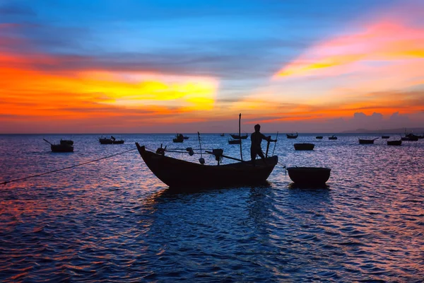 Silhouettes of fishing boats on a sunset — Stock Photo, Image