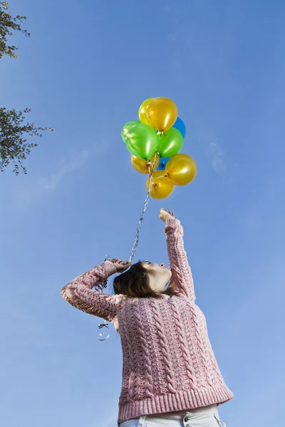 Girl with balloons — Stock Photo, Image